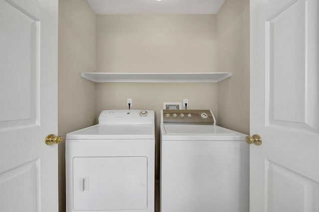 laundry room featuring washing machine and dryer