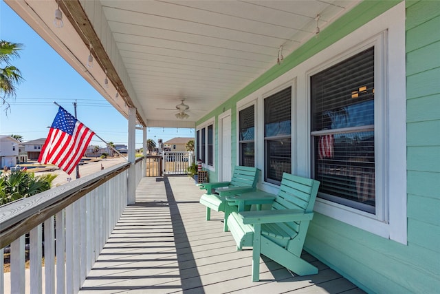 wooden deck with ceiling fan and covered porch