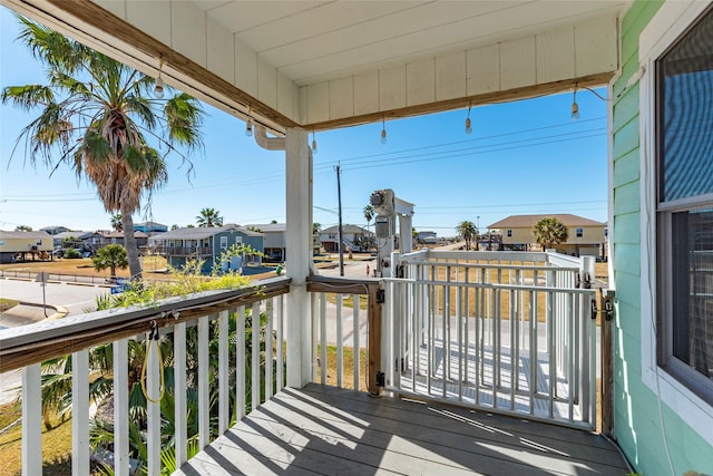 wooden terrace with a residential view