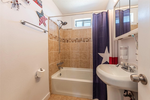 bathroom with baseboards, shower / bath combo with shower curtain, and tile patterned floors