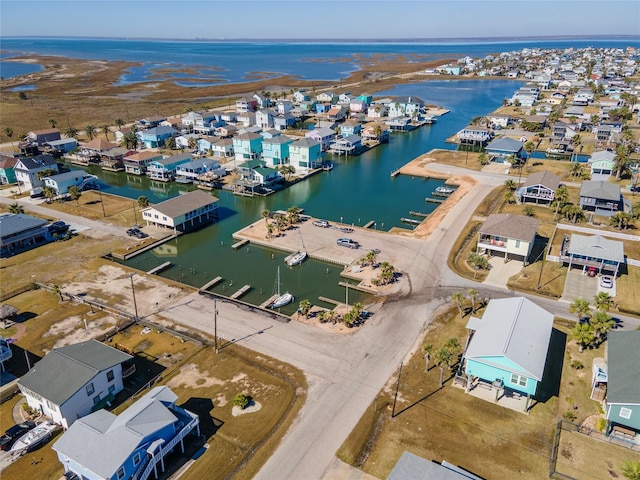 bird's eye view with a water view and a residential view