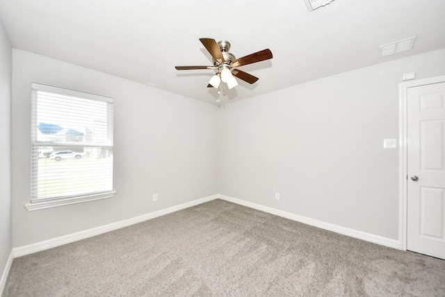 carpeted empty room with ceiling fan