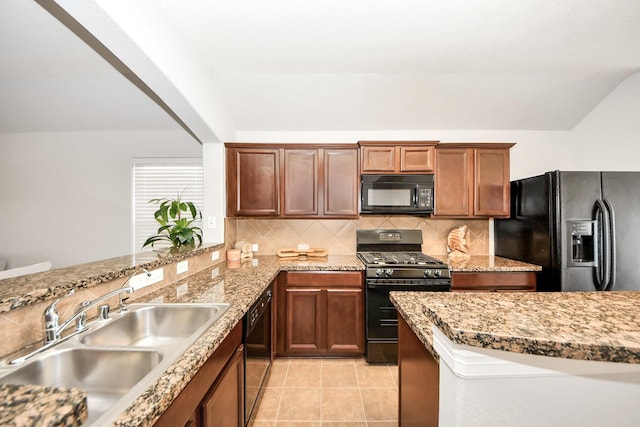 kitchen featuring sink, light tile patterned floors, backsplash, and black appliances