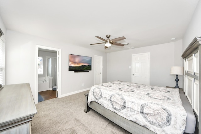 carpeted bedroom featuring ceiling fan and ensuite bathroom