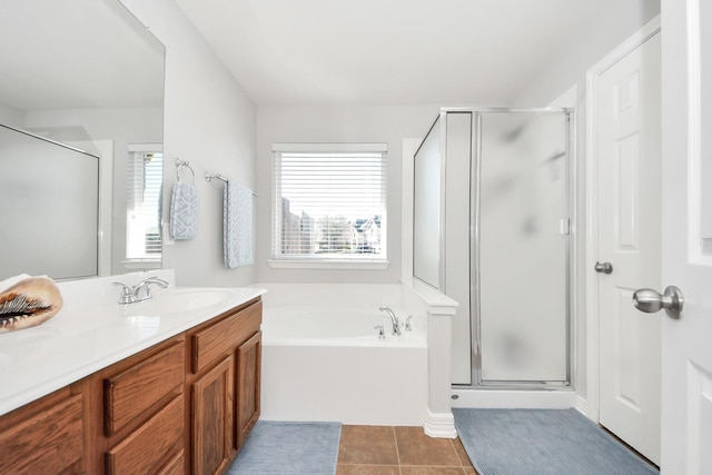 bathroom with vanity, tile patterned floors, a healthy amount of sunlight, and separate shower and tub