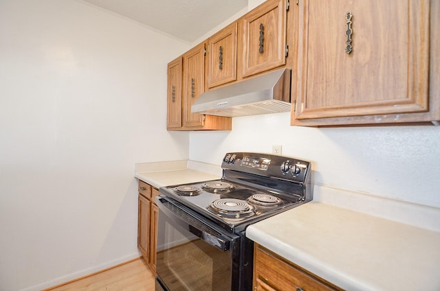 kitchen featuring black electric range oven, wall chimney range hood, and light wood-type flooring