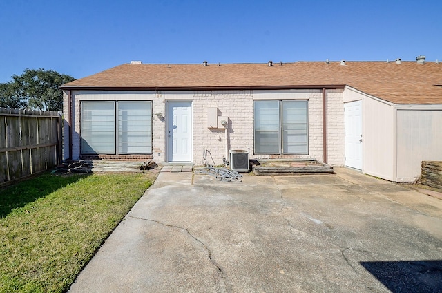 back of house with central AC unit and a patio area