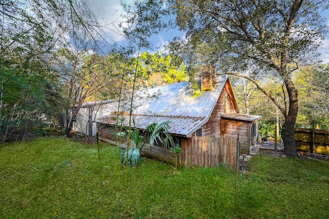 view of outbuilding with a yard