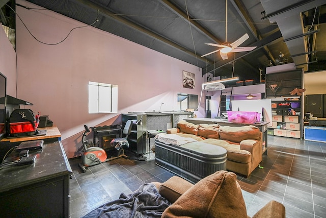 interior space featuring high vaulted ceiling and ceiling fan