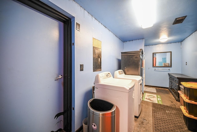 washroom with separate washer and dryer