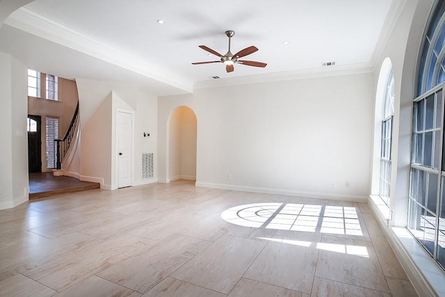 unfurnished room featuring crown molding and ceiling fan