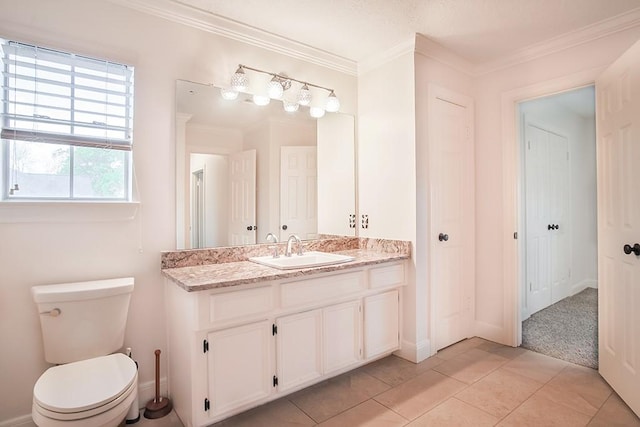 bathroom featuring crown molding, vanity, toilet, and tile patterned flooring