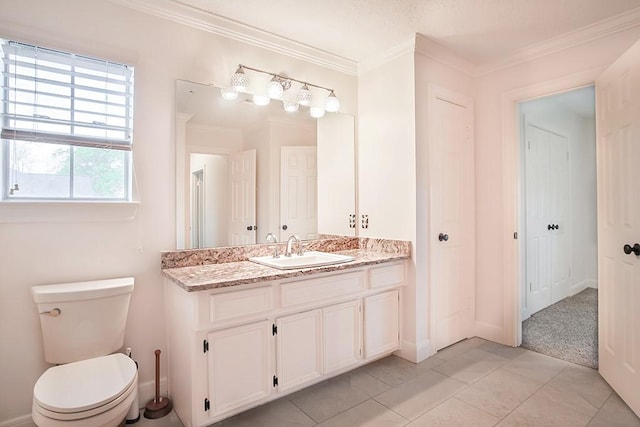 bathroom with vanity, tile patterned flooring, crown molding, and toilet