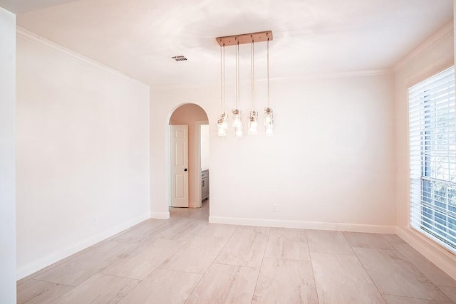 spare room with crown molding