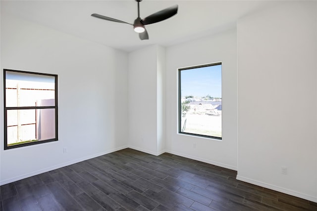 empty room featuring plenty of natural light and ceiling fan