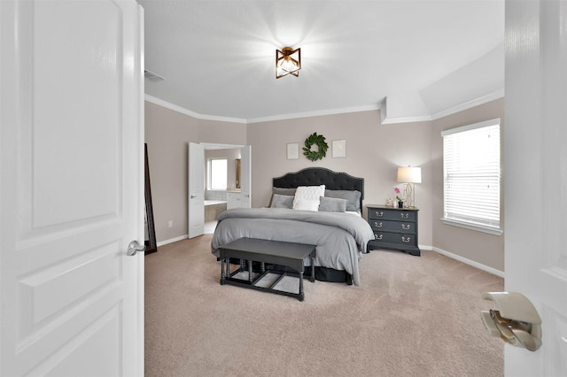 carpeted bedroom featuring ornamental molding, ensuite bathroom, and multiple windows