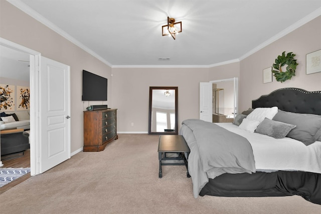 bedroom with ornamental molding and carpet