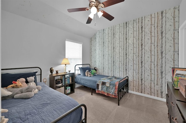 bedroom with vaulted ceiling, light colored carpet, and ceiling fan