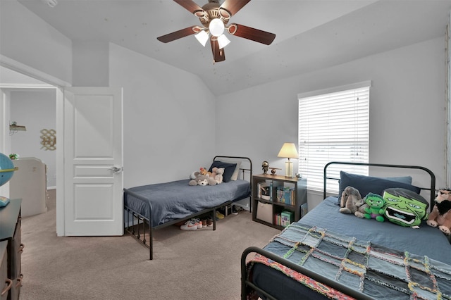 carpeted bedroom with lofted ceiling and ceiling fan