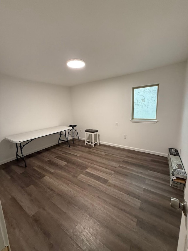 empty room with dark wood-type flooring