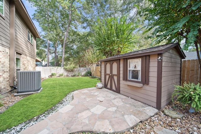 view of patio featuring central AC and a storage unit