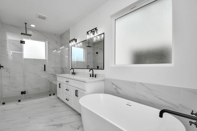 bathroom featuring vanity, plus walk in shower, and tile walls