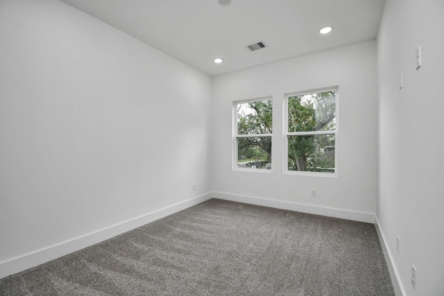 unfurnished room with carpet flooring