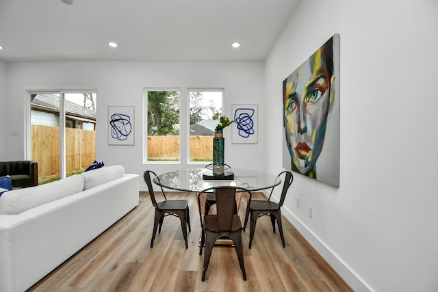 dining space featuring light wood-type flooring