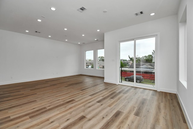 spare room with light hardwood / wood-style floors