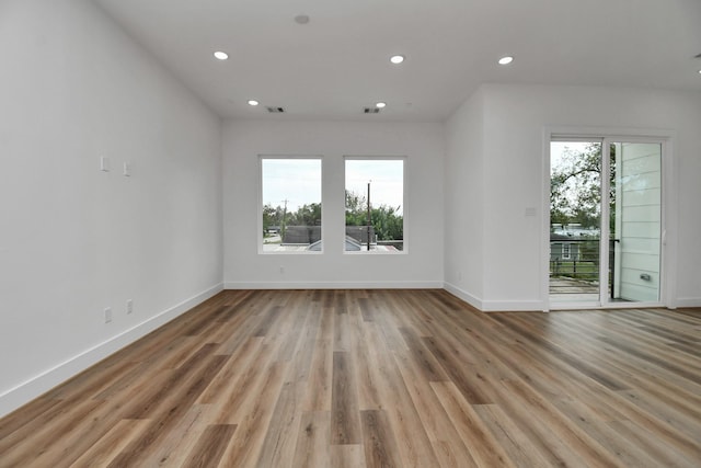 spare room featuring light hardwood / wood-style floors