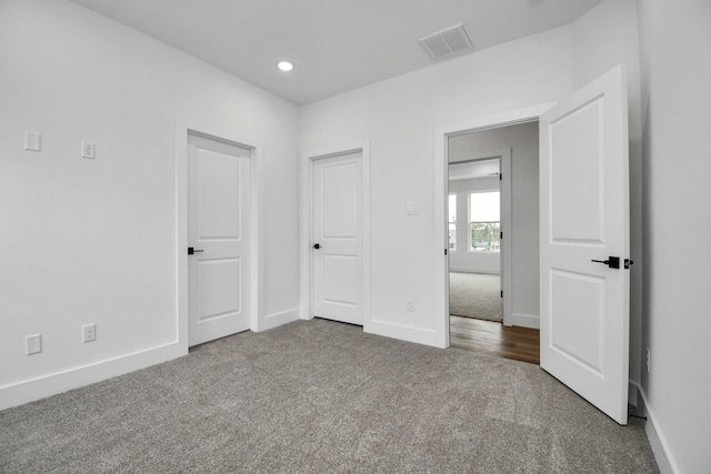 unfurnished bedroom with carpet flooring