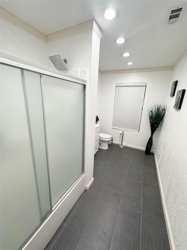 bathroom featuring a stall shower, baseboards, visible vents, toilet, and recessed lighting