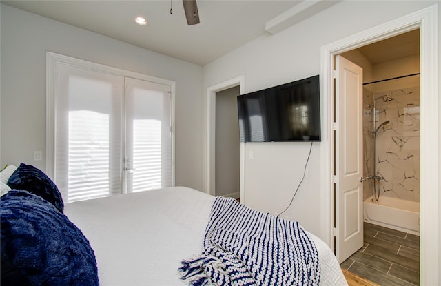 bedroom featuring ensuite bath and ceiling fan