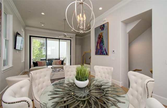 dining room with a notable chandelier and crown molding