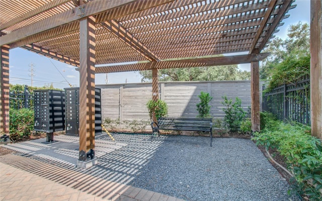 view of patio / terrace with a pergola and a mail area