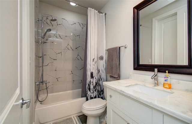 full bathroom with vanity, shower / bath combo, and toilet