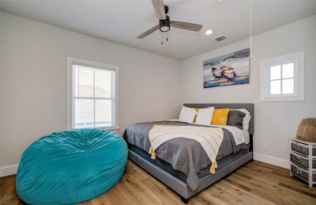 bedroom featuring wood-type flooring and ceiling fan