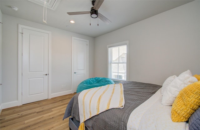 bedroom featuring ceiling fan and light hardwood / wood-style floors