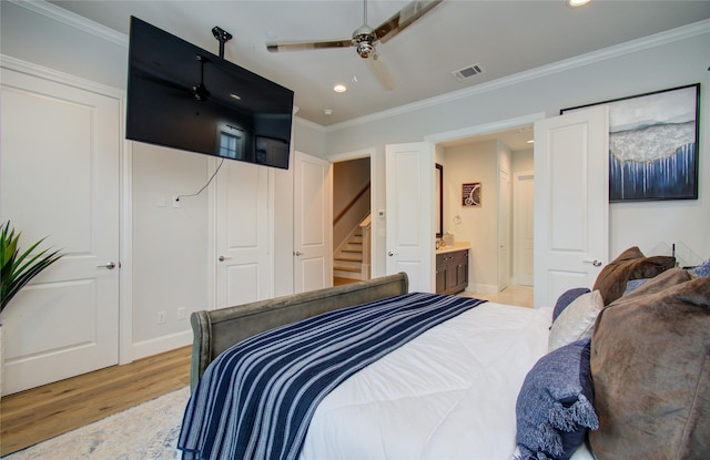 bedroom featuring ensuite bathroom, ornamental molding, ceiling fan, and light hardwood / wood-style flooring