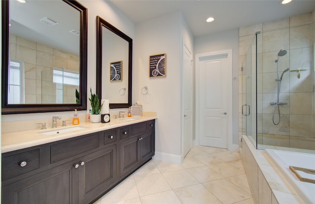 bathroom featuring vanity, tile patterned floors, and a shower with door