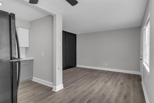 interior space with a healthy amount of sunlight, a textured ceiling, and light hardwood / wood-style floors