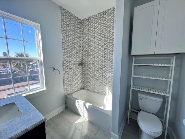 bathroom featuring tile patterned floors, vanity, and toilet