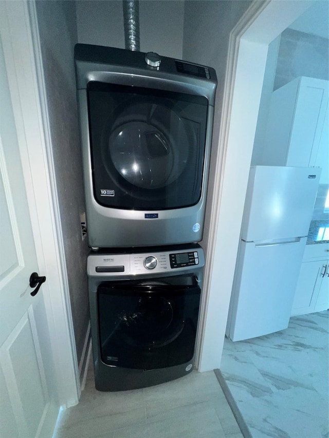 laundry room featuring stacked washing maching and dryer