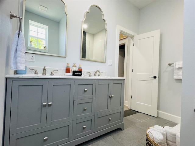 bathroom featuring vanity and tile patterned flooring