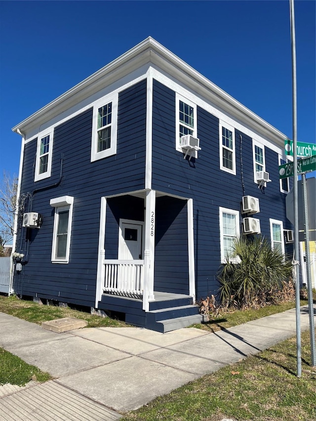 view of front facade featuring cooling unit