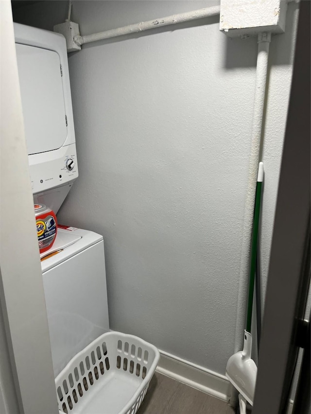 laundry room with stacked washer and clothes dryer