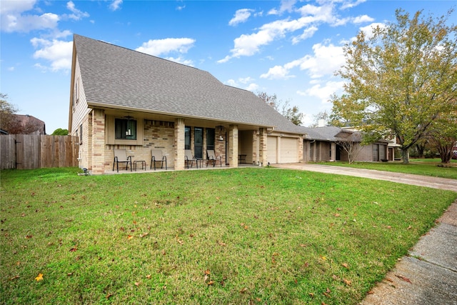 view of front of home with a garage and a front yard