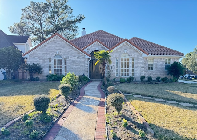 view of front of property with a front lawn