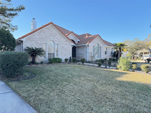 ranch-style home with a front yard