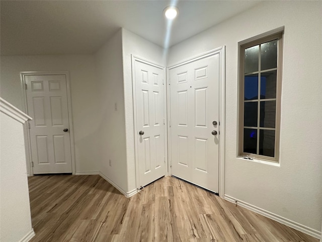 foyer with light hardwood / wood-style floors